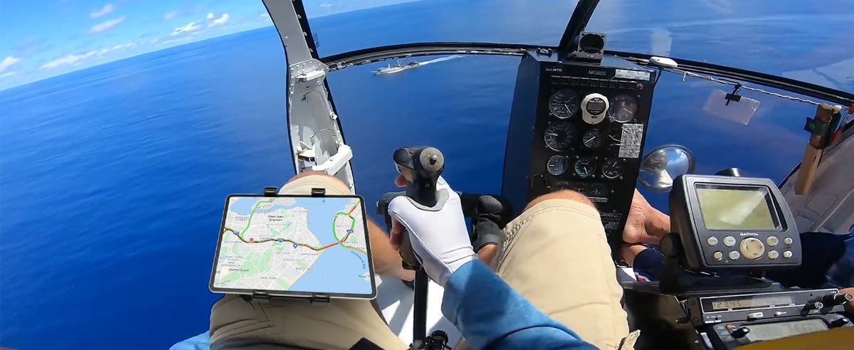 Pilot using OHLPRO kneeboard with tablet during a flight, adjustable for optimal viewing angles