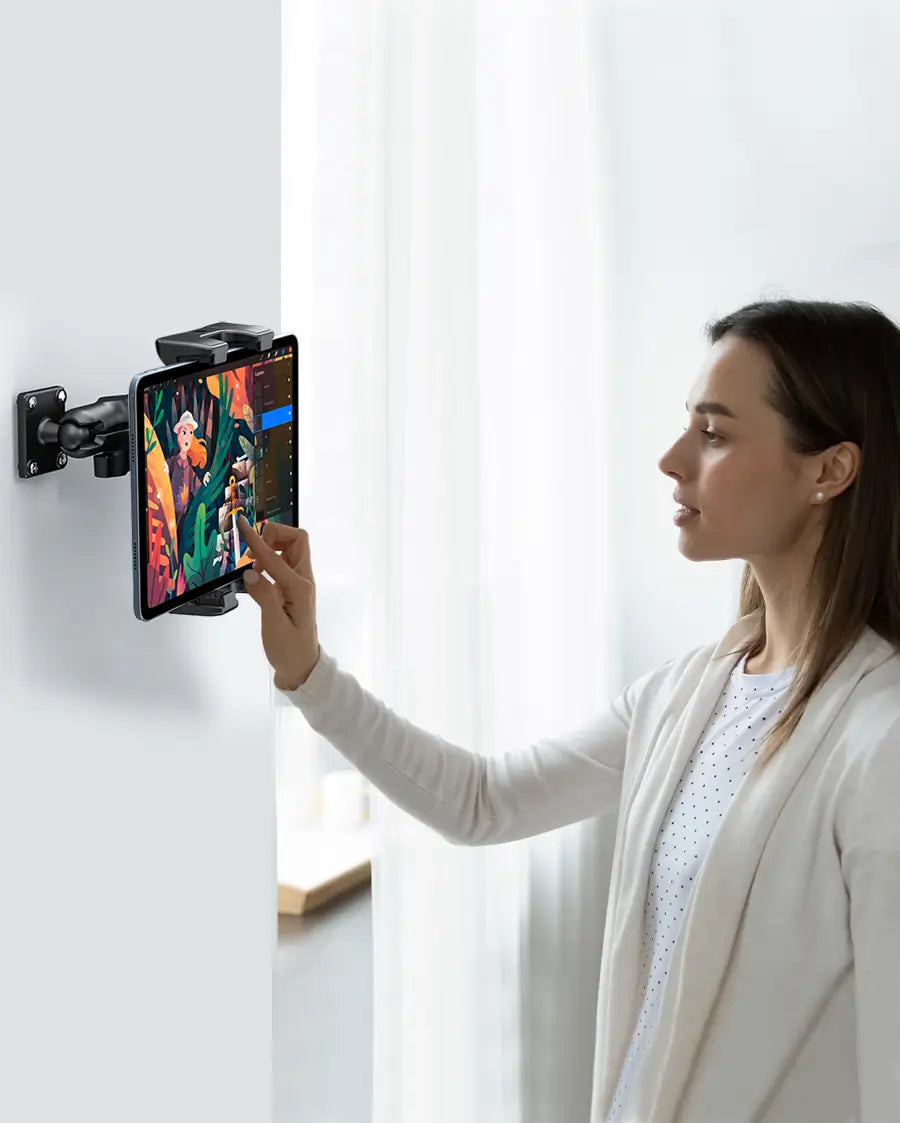 Mounting the tablet holder on the wall with drill base for hands-free viewing